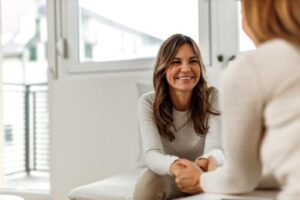 a person talks to a therapist during motivational interviewing